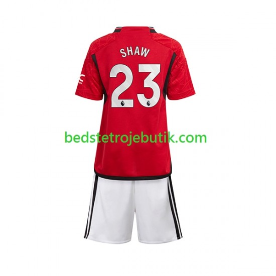 Manchester United Luke Shaw 23 Børn Hjemmebane Fodboldtrøje 2023-2024 Kortærmet